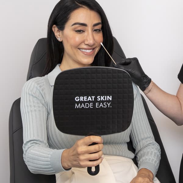 Injector reviewing results with patient