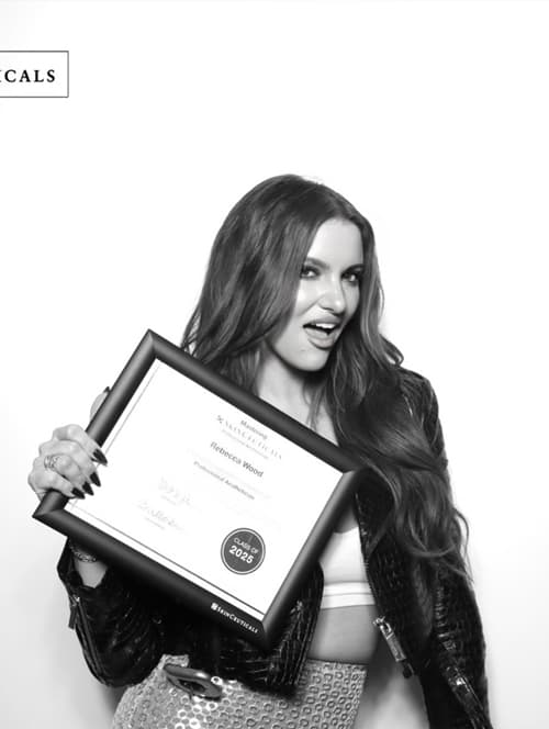 Instagram post: Rebecca Wood holding up Professional Aesthetician certification.