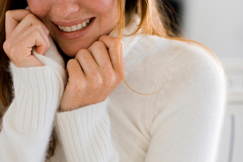 woman wearing cozy sweater