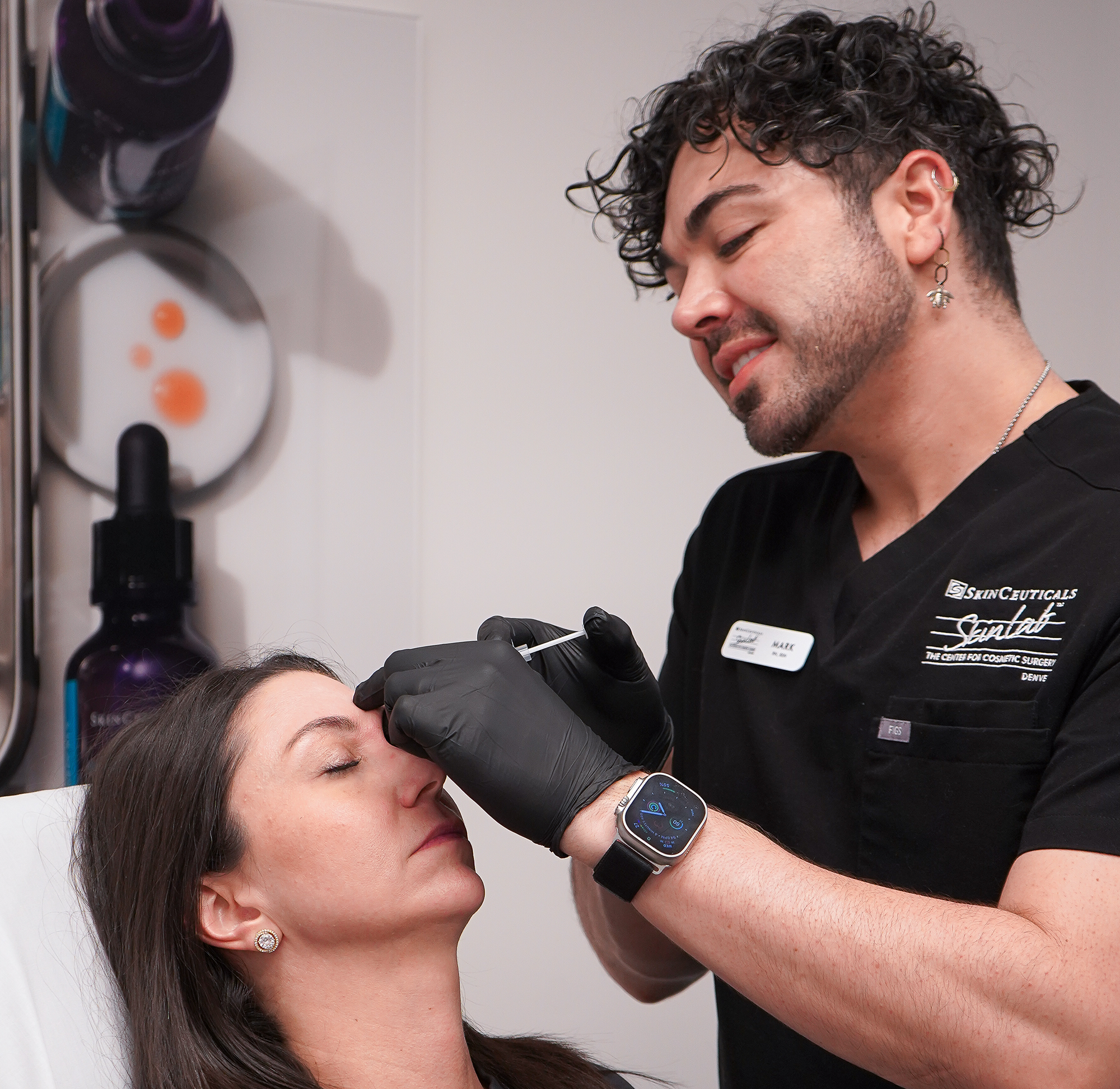 Close-up of a cosmetic injectable treatment being administered in a clinical setting.